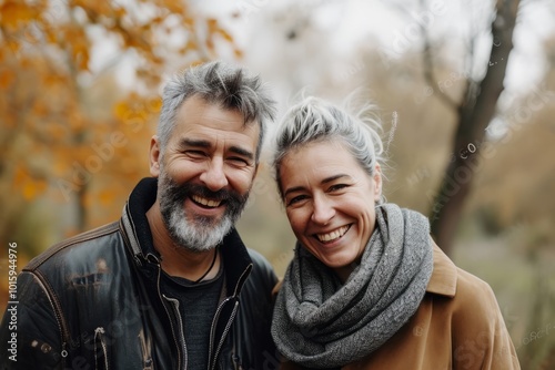 Portrait of a happy senior couple in autumn park. Mature couple in love.