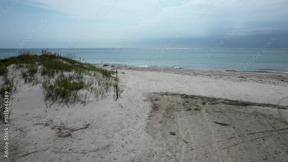 Sand dunes and high tide, drone shot, aerail Sand dunes and high tide, drone shot, aerail