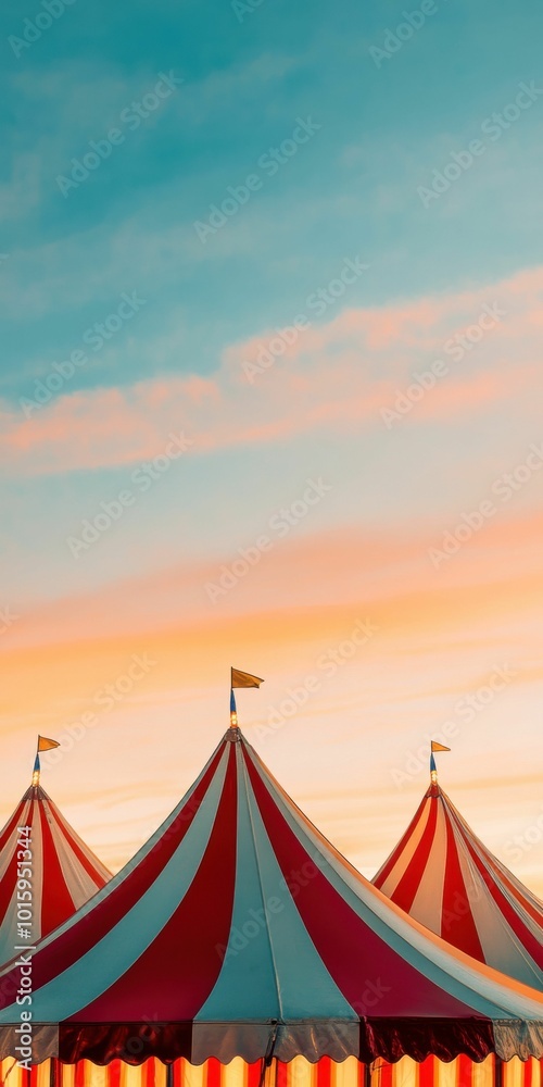 Striped red, white, and blue carnival tents with small flags are set against a pastel sunset sky, creating a festive and nostalgic carnival atmosphere. Striped red, white, and blue carnival tents with small flags are set against a pastel sunset sky, creating a festive and nostalgic carnival atmosphere.