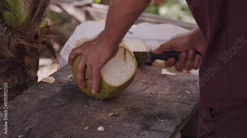 Man Breaking Fresh Coconut First Time