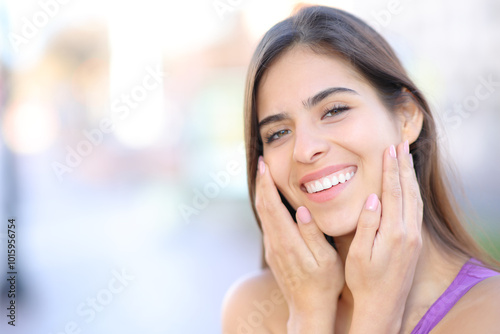 Happy woman with perfect teeth and manicure posing