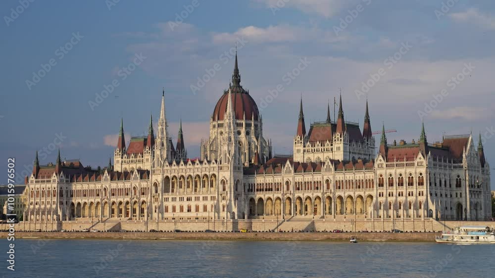 Timelapse of Budapest. Building of Hungarian Parliament with walking tourists and city car traffic along Danube River Timelapse of Budapest. Building of Hungarian Parliament with walking tourists and city car traffic along Danube River