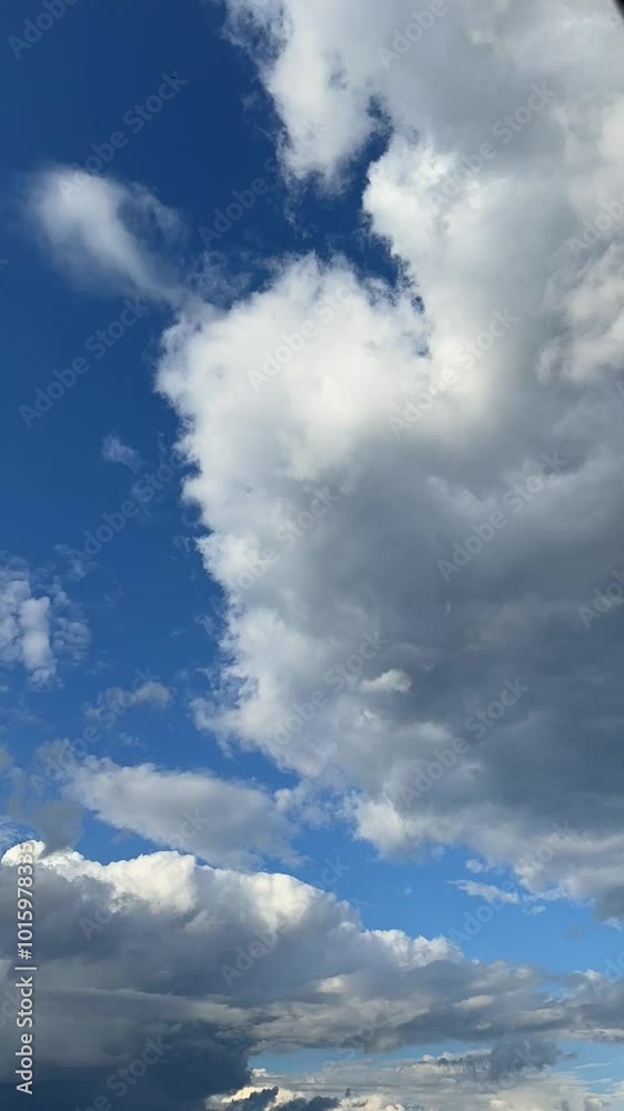 moving clouds against a clear blue sky captured in timelapse moving clouds against a clear blue sky captured in timelapse