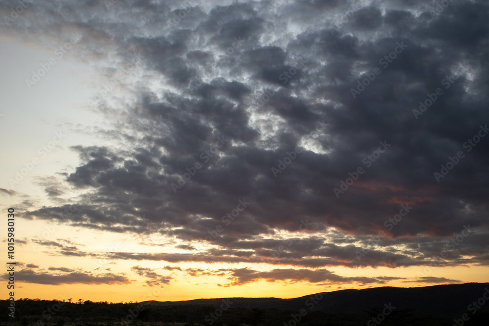 A moody sky at sunset in the hills A moody sky at sunset in the hills