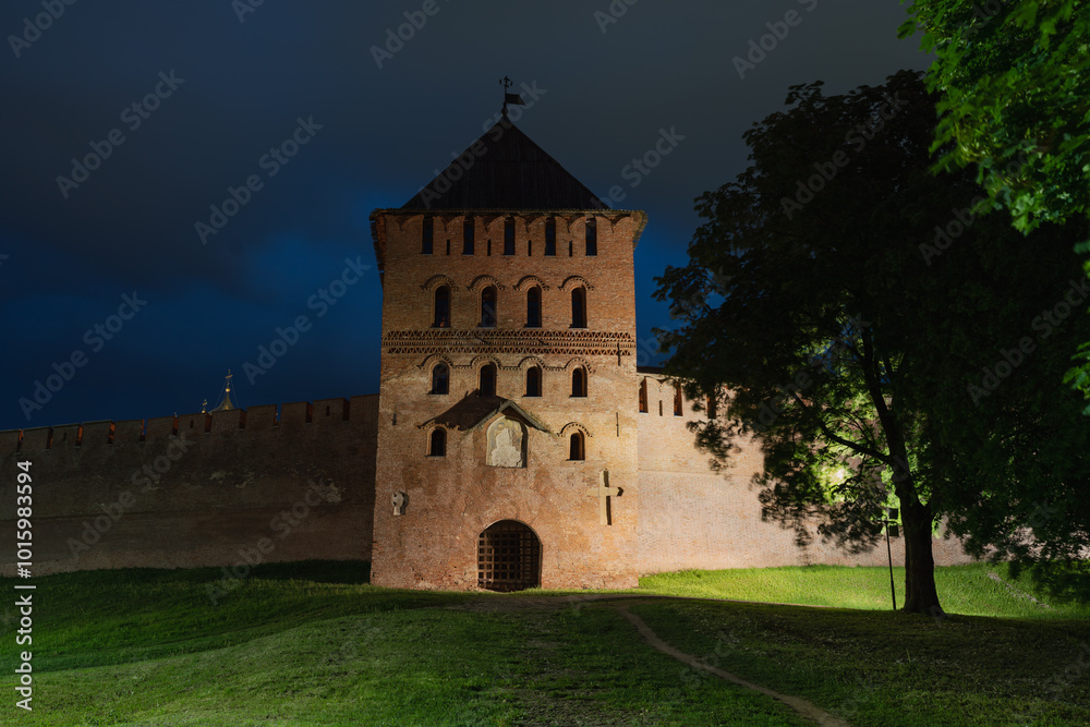 Obraz premium The Vladimir Passage Tower of the Kremlin in Veliky Novgorod. The facade of the Vladimir Tower. Fresco image of Nikola. High quality photo