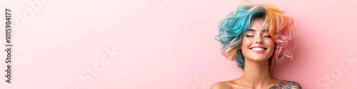 Happy young woman with colorful hair smiling against a pink background