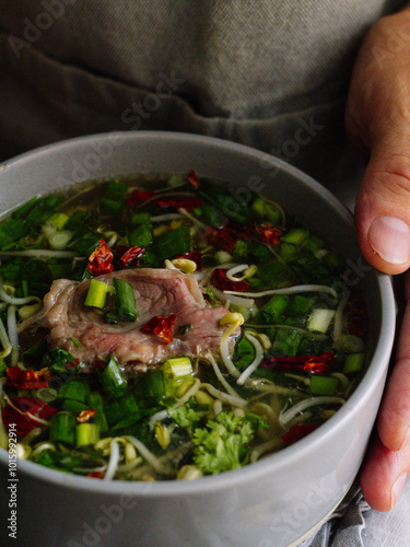 Asian soup with meat and herbs

