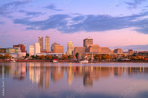 Peoria, Illinois, USA. Cityscape image of Peoria skyline, Illinois, USA with reflection of city lights in the Illinois River at autumn sunrise. photo