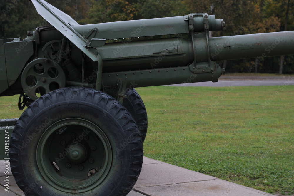 cannon on wheels of dark green color, cannon on wheels of dark green color,