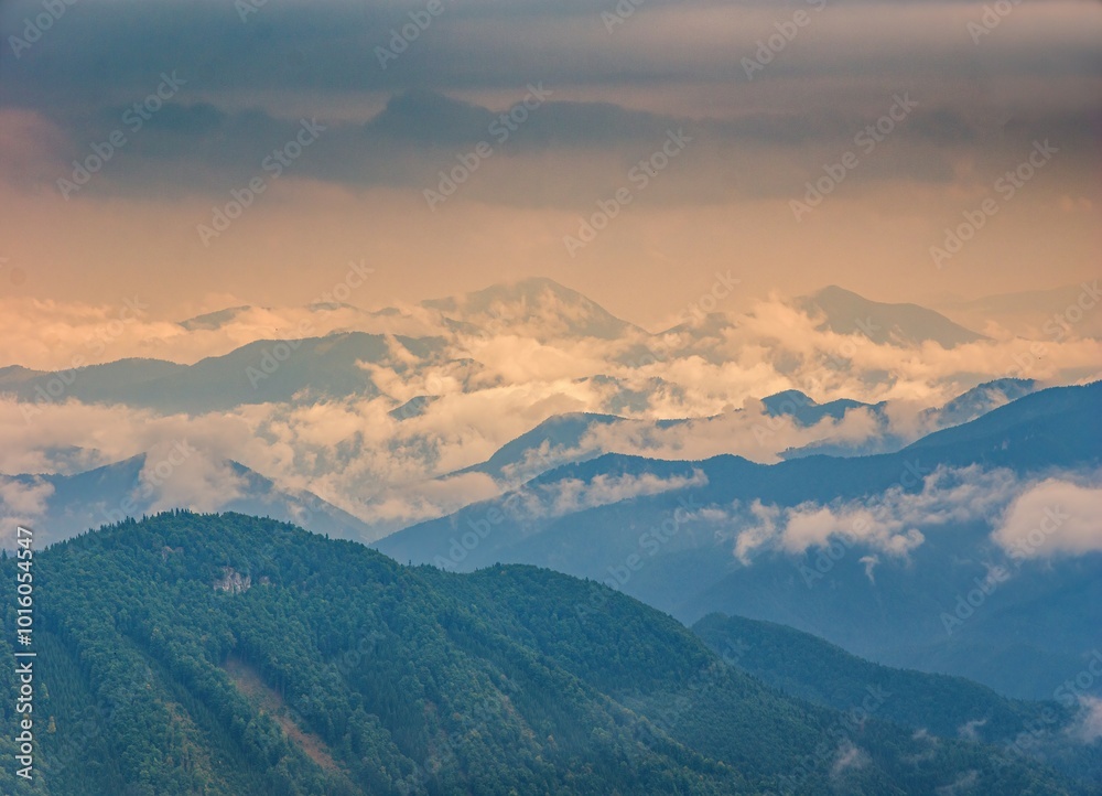 Mountain landscape after a storm. Autumn landscape, forested and rocky hills of fog, rain and clouds. Mountain landscape after a storm. Autumn landscape, forested and rocky hills of fog, rain and clouds.