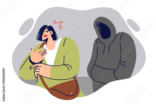 Stalker stalks woman, hiding face under hood, in order to commit crime and steal purse
