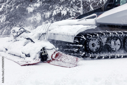 Snow groomer ratrack machine, ski slope photo