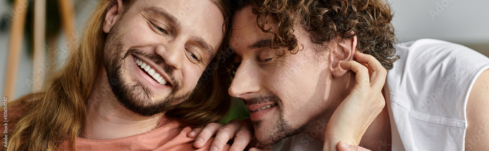 Two men share a tender moment, enjoying each other at home. Two men share a tender moment, enjoying each other at home.