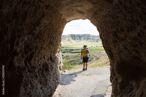 Hiker on the trail at the tunnel at Scotts Bluff National Monument, Nebraska
