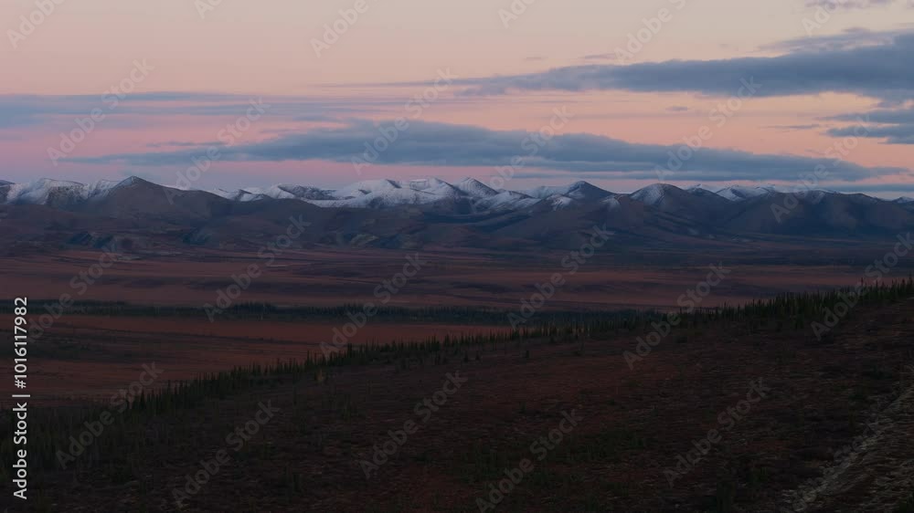 Arctic Circle Landscape In Fall Colors At Dusk In Yukon Territory, Canada. wide shot Arctic Circle Landscape In Fall Colors At Dusk In Yukon Territory, Canada. wide shot