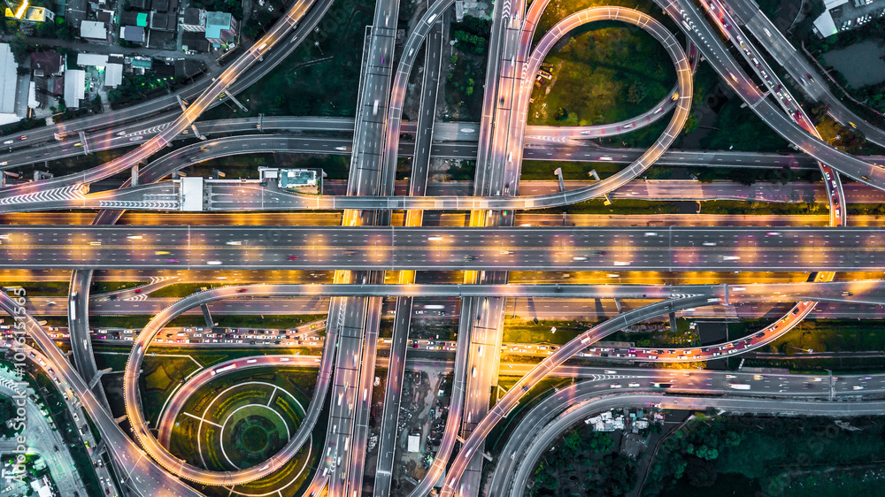 Aerial view elevated road and traffic junctions, Modern construction design traffic ways traffic jams, Road interchange or highway intersection with busy urban traffic Junction network transportation. Aerial view elevated road and traffic junctions, Modern construction design traffic ways traffic jams, Road interchange or highway intersection with busy urban traffic Junction network transportation.