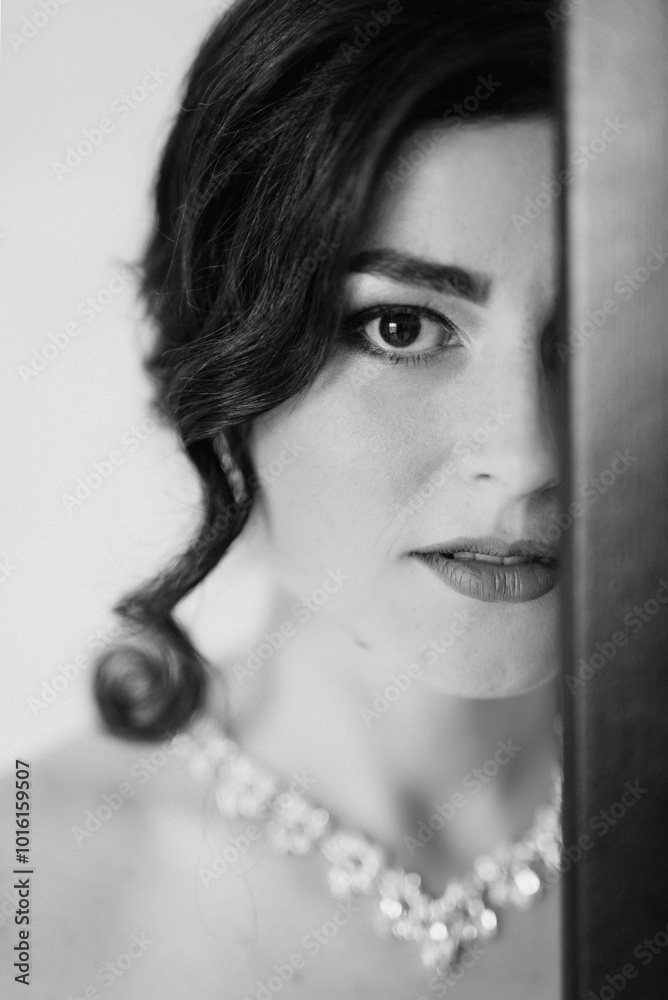 Obraz premium black-haired bride girl getting ready for groom in boudoir