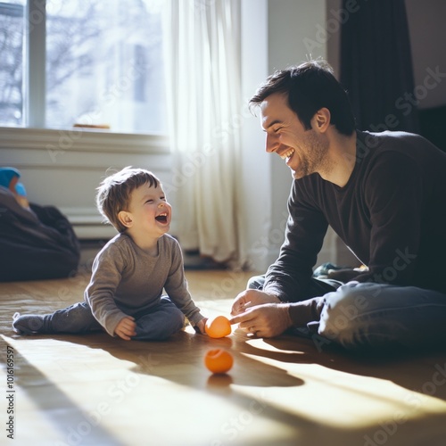 A joyful moment between a father and his toddler as they play with toys on the floor. Natural light fills the cozy living room, enhancing the warm and happy atmosphere of family bonding. photo