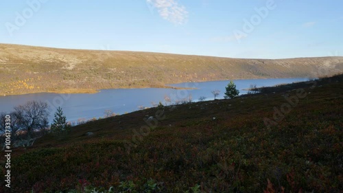 View from a hilside overloking a Swedish alpine lake. photo