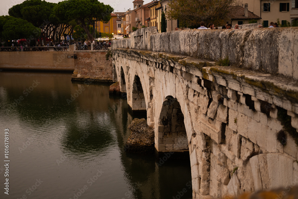 Discover the iconic Ponte di Tiberio, a Roman bridge spanning the River Marecchia in Rimini, Italy. Built in 20 AD, this majestic structure is a testament to Roman engineering and a must-see