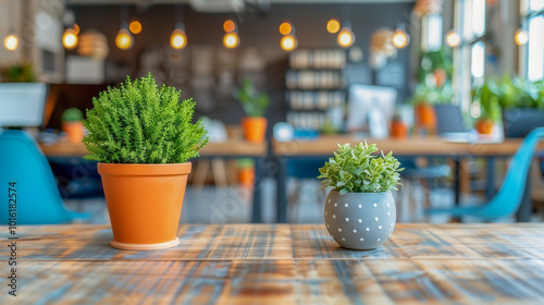 Modern Workspace with Decorative Potted Plants on Wooden Table..