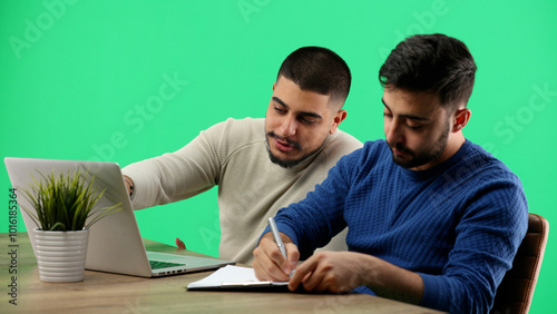 Men, close-up, on a green background, is working