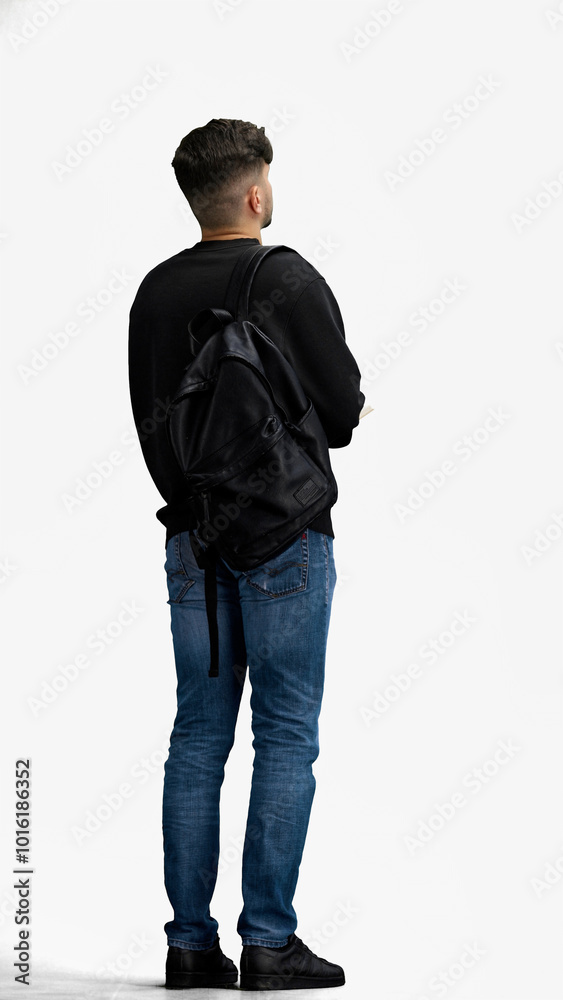 Fototapeta premium A man, full-length, on a white background, with a backpack