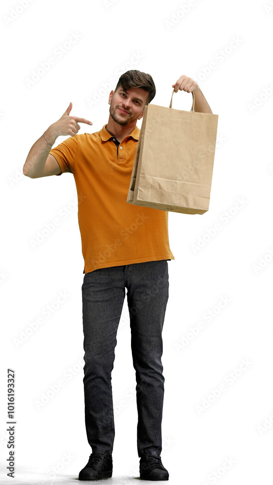 A man, full-length, on a white background, points to the packages A man, full-length, on a white background, points to the packages