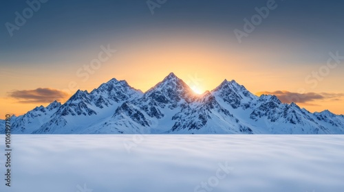 Glorious winter sunrise over snow-capped mountains with untouched snowfields and soft light on the peaks 