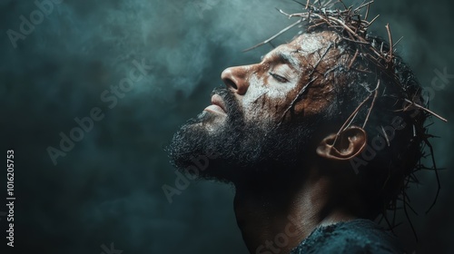 A profile view of a bearded man in deep reflection, wearing a crown of thorns, creating an atmosphere that suggests introspection and contemplation in dim light. photo