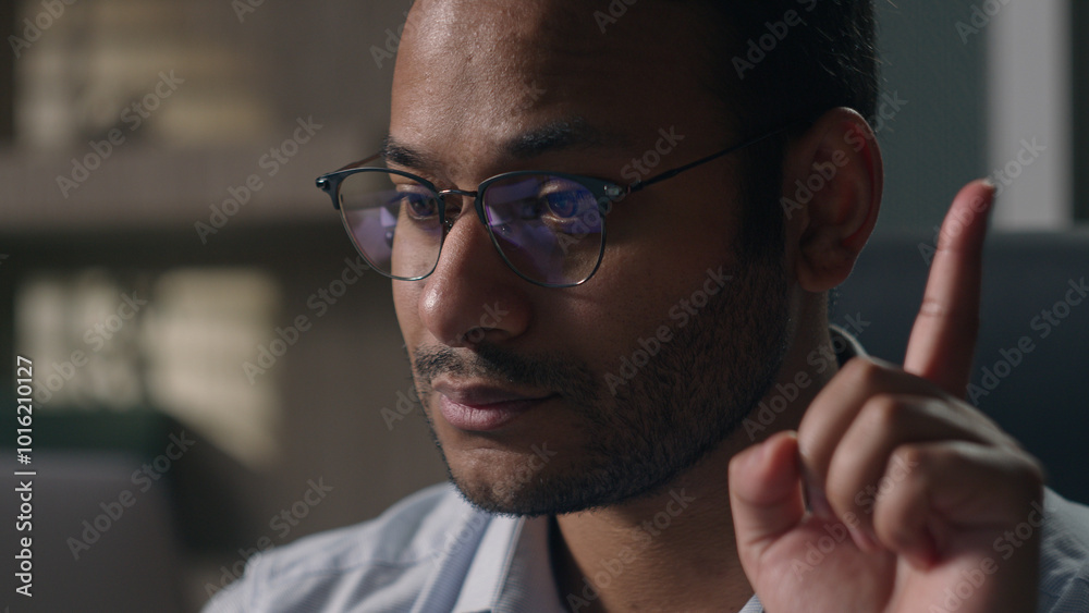 Close up Indian man in glasses Arabian businessman with laptop thinking find answer eureka rise index finger up employer come up with idea solving problem solution working computer creative decision Close up Indian man in glasses Arabian businessman with laptop thinking find answer eureka rise index finger up employer come up with idea solving problem solution working computer creative decision