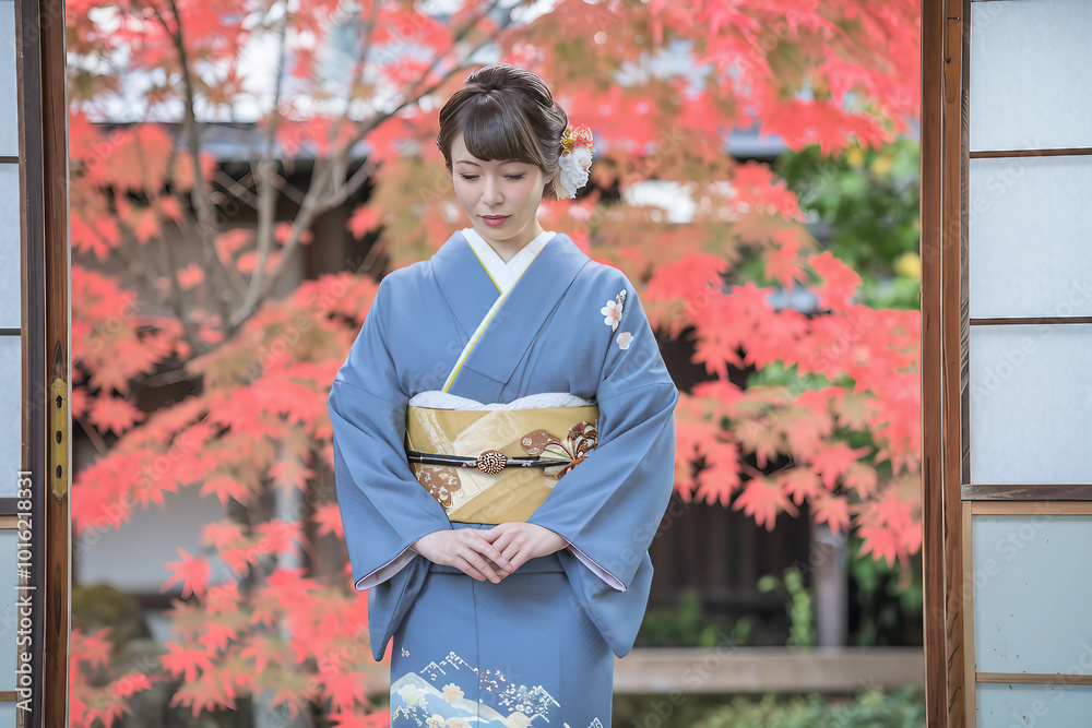 Woman in traditional Japanese kimono standing amidst autumn maple leaves
Woman in traditional Japanese kimono standing amidst autumn maple leaves