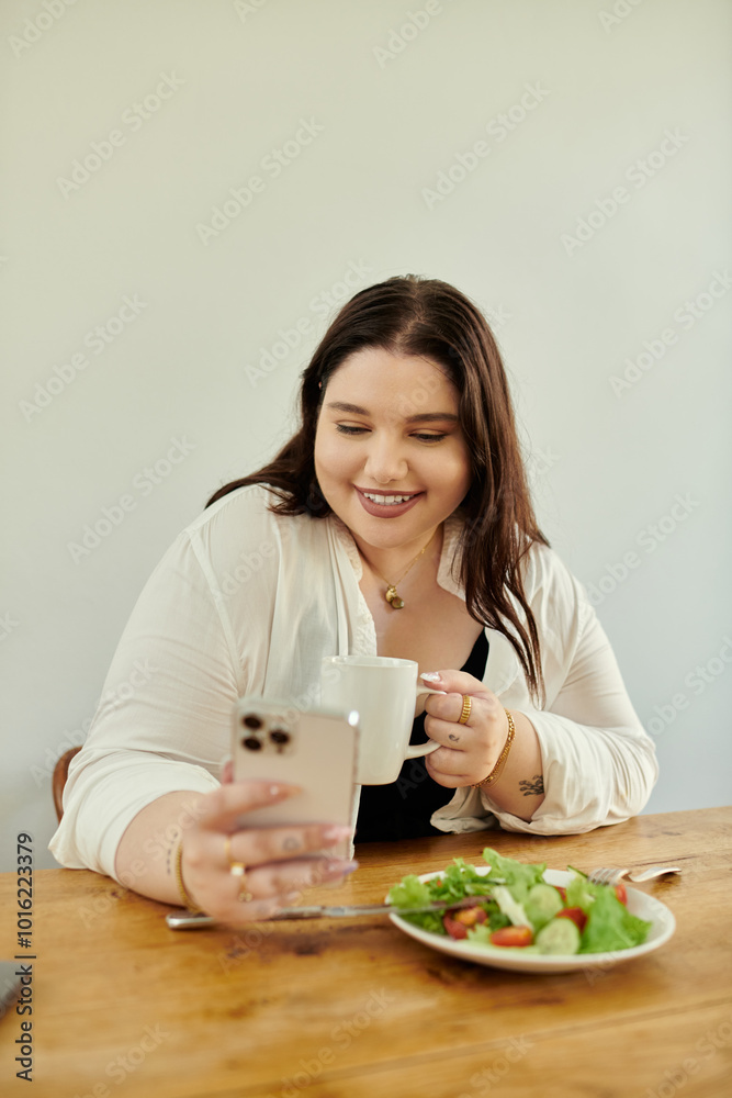 Smiling woman sips coffee while checking her phone and enjoying a healthy meal. Smiling woman sips coffee while checking her phone and enjoying a healthy meal.