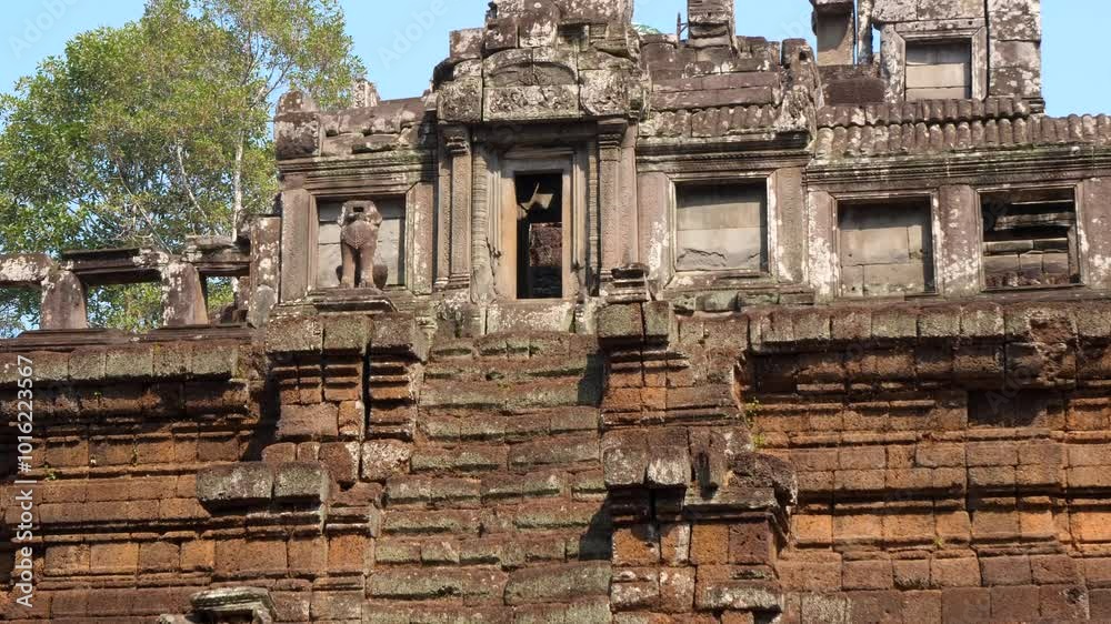 The majestic Cambodian temple rises into the morning light, casting shadows across its weathered stones. A clear blue sky enhances the serene atmosphere as the day begins. The majestic Cambodian temple rises into the morning light, casting shadows across its weathered stones. A clear blue sky enhances the serene atmosphere as the day begins.