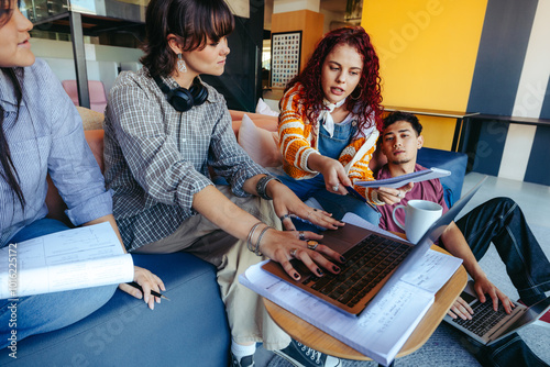 High school students collaborate on a group project, engaged in active learning and teamwork in a modern classroom setting photo