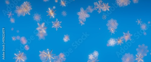 Winter Wonderland: Glittering Snowflakes Against a Vibrant Blue Sky