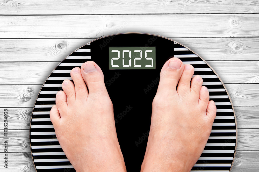 2025 feet on a weight scale, nutrition and diet during holidays, new year card