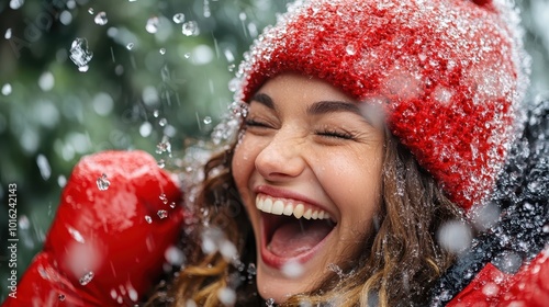 A vibrant image showcasing a girl in a red hat and gloves, joyfully laughing as snowflakes fall around her, capturing a moment of pure happiness and winter bliss. photo