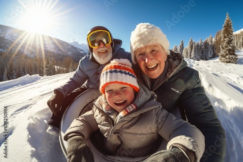 A stunning high-resolution photograph of grandparents and their granddaughters enjoying a snowy mountain tubing ride. The photograph conveys the joy of this exciting snow adventure. Hobbies