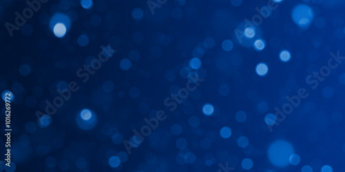 Blue Defocused Lights on a dark blue background. Glittering Defocused Lights Abstract Background