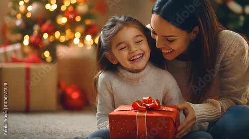 Mother and Daughter Excitedly Looking at a Christmas Gift