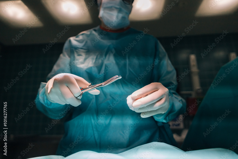 A doctor, masked and gloved, holds a surgical instrument with steady hands, preparing to make a precise movement A doctor, masked and gloved, holds a surgical instrument with steady hands, preparing to make a precise movement