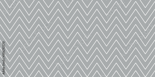 Christmas chevron pattern. Abstract background with white zig-zag stripes on a grey background. Vector illustration