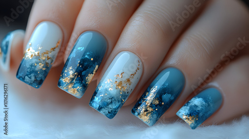 A stylish set of light blue and white nails adorned with elegant gold accents, showcasing a contemporary and chic design. This eye-catching nail art features a perfect blend of colors and textures, re