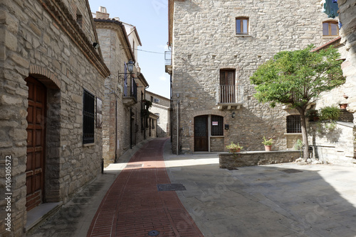 Fototapeta Naklejka Na Ścianę i Meble -  A small street among the old houses of a Guardia Perticara, small town in Basilicata, Italy.