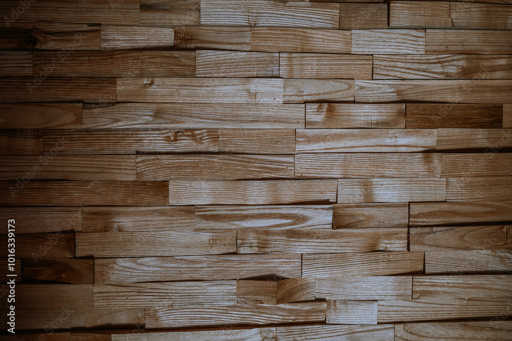 Stacked wooden planks with natural grain patterns create a textured wall background, showcasing a warm, rustic aesthetic.. Stacked wooden planks with natural grain patterns create a textured wall background, showcasing a warm, rustic aesthetic..