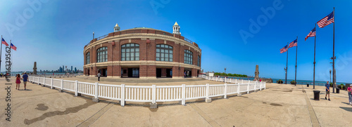 Chicago, IL - July 26, 2024: Tourists and locals relax at Navy Pier on a beautiful summer day. Panoramic view photo