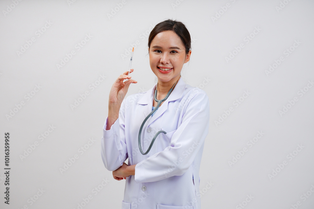 Female doctor in medical gown holding syringe on white background. Female doctor in medical gown holding syringe on white background.