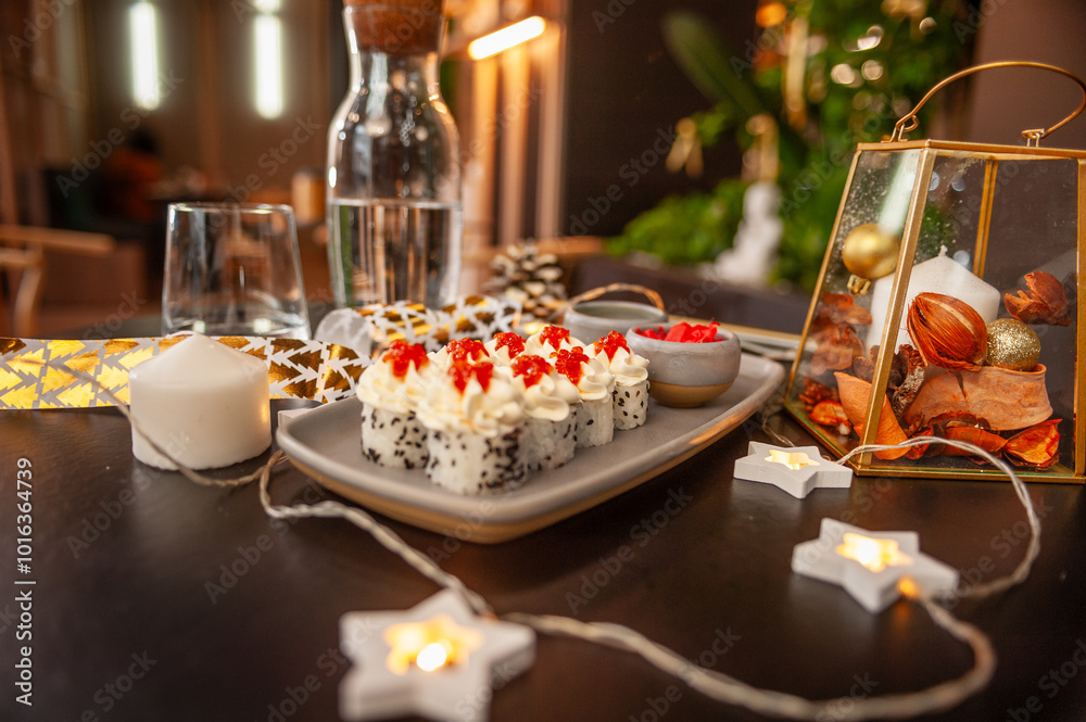 Sushi roll with cream cheese, sesame seeds and salmon caviar Sushi roll with cream cheese, sesame seeds and salmon caviar