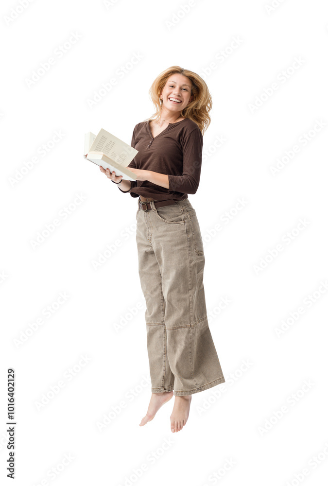 Fototapeta premium Cheerful smart woman reading a book and jumping